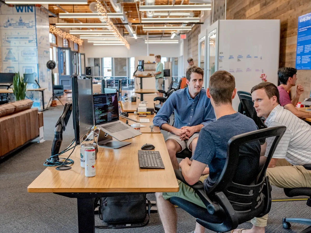 Consultants reviewing work around a table